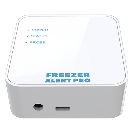 Freezer Alert Pro cellular monitor in front of a home chest freezer